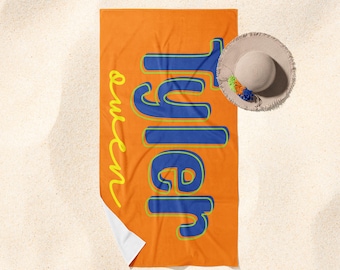 May include: Orange beach towel with the text "Julep Queen" in blue and yellow lettering.
