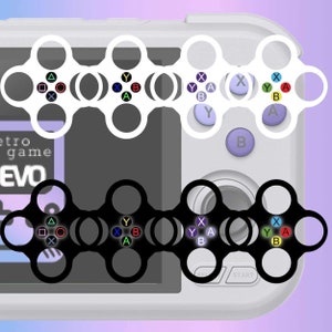 May include: A close-up of a white and black handheld gaming console with a retro game design. The console has a screen, buttons, and a joystick. The text "retro game EVO" is visible on the screen.