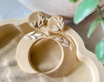 Pendientes de arcilla polimérica con diseño de luna floral, joyería celestial, pendientes de eclipse
