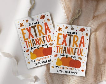 May include: Two white gift tags with the text "We are EXTRA THANKFUL for you." The tags feature illustrations of pumpkins, pears, and fall leaves. The bottom of the tags read "We appreciate you! FROM: YOUR NAME."