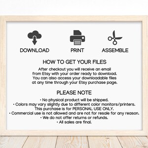 May include: A digital instruction sign in a light wood frame featuring black text and icons. The text reads: DOWNLOAD, PRINT, ASSEMBLE, HOW TO GET YOUR FILES, and PLEASE NOTE, followed by specific instructions regarding digital file access and usage.