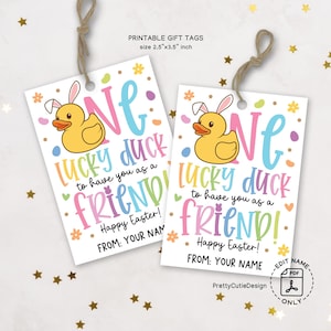 May include: Two printable gift tags featuring a cartoon duck with a bunny ear headband. The tags are decorated with pastel colors and confetti. The text on the tags reads "One lucky duck to have you as a friend! Happy Easter!" and "From: Your Name".
