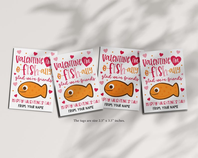 Fish valentine gift tag printable styled with modern, playful typography in pink and brown, cartoon fish graphic, and heart confetti, created to be printed on cardstock, cut out, and clipped to kraft lunch bags or treat sacks for children, classmates, and friends.