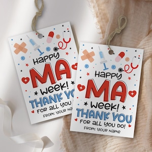 May include: Two white gift tags with the text "Happy MA Week! Thank You" in red and blue. The tags feature medical-themed illustrations like a stethoscope, syringe, and band-aid, with a twine string attached.