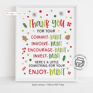 May include: A framed print with a white border features colorful text and festive graphics. The text reads "Thank you" and includes phrases like "Commit-Mint" and "Enjoy-Mint." The print is 8x10 inches.