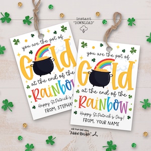 May include: Two printable gift tags featuring a rainbow and pot of gold design. The text reads "You are the pot of gold at the end of the rainbow." Happy St. Patrick's Day! From: [Your Name].