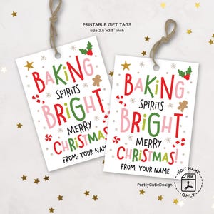May include: Two rectangular gift tags with the text "Baking Spirits Bright Merry Christmas!" in red, green, and pink. The tags are white with a brown string and measure 2.5" x 3.5". Decorative elements include stars, snowflakes, and gingerbread men.