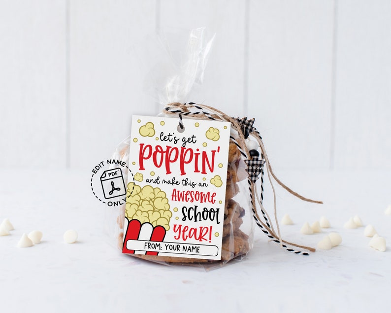 Back to school popcorn tag printable shown on paper bags using clothespins, includes editable field ‘From: Your Name’ for teachers, parents or classmates