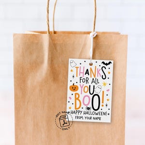 Playful Halloween tag with bold mixed-size typography, orange pumpkin face, white ghosts, black bat, spider, stars, and pink and orange accents.