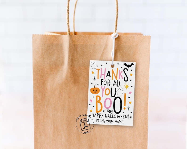 Playful Halloween tag with bold mixed-size typography, orange pumpkin face, white ghosts, black bat, spider, stars, and pink and orange accents.