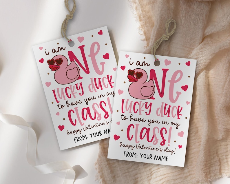 Valentine classroom tag printable attached to brown paper sacks using mini clothespins, showcasing a cute duck graphic, heart accents, and bold lettering, meant for teachers to quickly assemble thoughtful student gifts, snack bags, or party favors for the whole class.