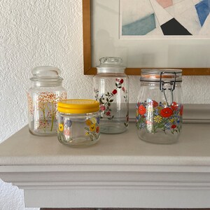 Lot of (4) vintage floral glass canisters storage