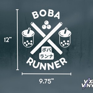 May include: White vinyl sticker with a boba tea design. The sticker features two boba tea cups with straws, crossed bamboo sticks, and the text "BOBA RUNNER" with Japanese text in the center. The sticker measures 9.75 inches wide and 12 inches tall.