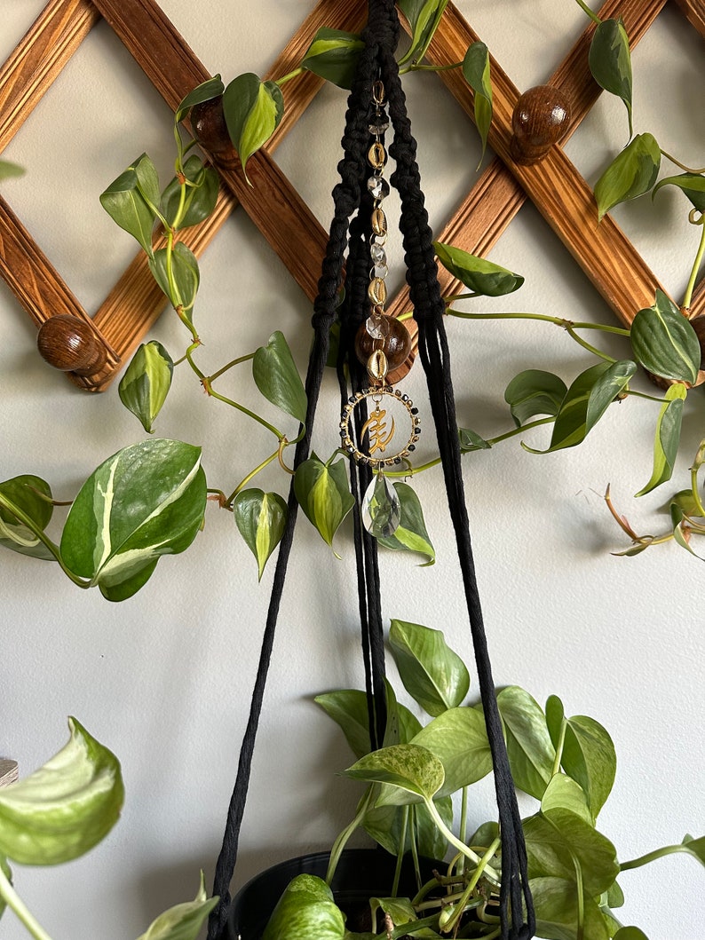 Black macrame plant hanger with suncatcher crystal gold cowrie shells and adinkra symbol gye nyame image 2