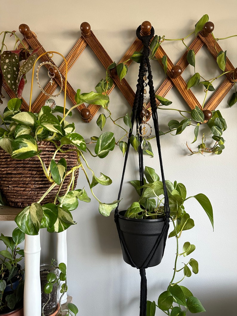 Black macrame plant hanger with suncatcher crystal gold cowrie shells and adinkra symbol gye nyame image 1