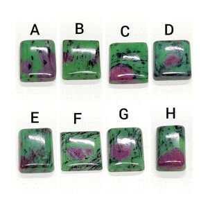 May include: Eight green and pink gemstone cabochons labeled A through H. The gemstones are square and rectangular in shape.