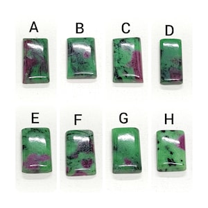 May include: Eight rectangular green gemstones with black and pink inclusions. The gemstones are labeled A through H.