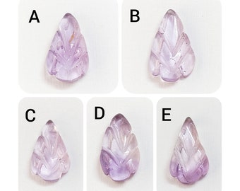 May include: Five amethyst leaf-shaped pendants, each with a unique carved design. The pendants are labelled A through E.