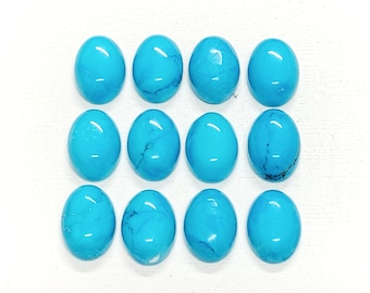 May include: Twelve oval-shaped turquoise cabochons, each with a smooth, polished surface and a vibrant blue color.