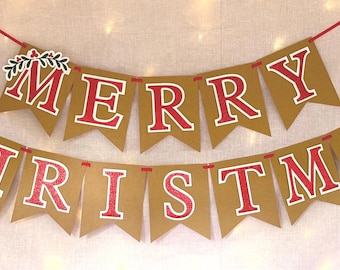 May include: A festive banner featuring two rows of brown pennant flags strung on a red cord. The flags display the text MERRY CHRISTMAS in bold red letters with white outlines. Decorative holly leaf accents are positioned at the ends.
