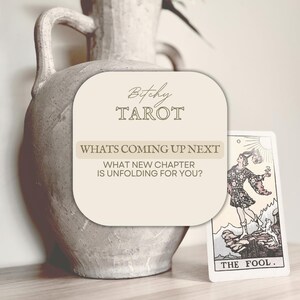 May include: A beige card with the text "Bitchy Tarot" and "What's Coming Up Next". A tarot card depicting "The Fool" is visible. A large, textured, beige vase is in the background.