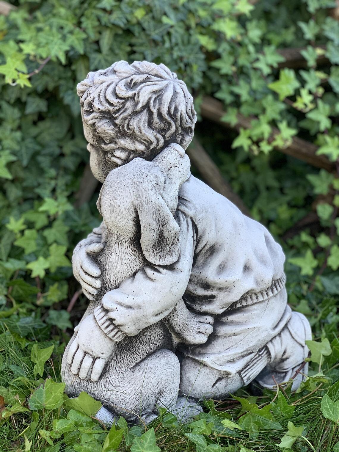 Statue of a little boy hugging a dog dog statue garden Etsy
