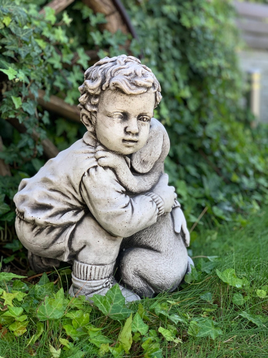 Statue of a little boy hugging a dog dog statue garden Etsy