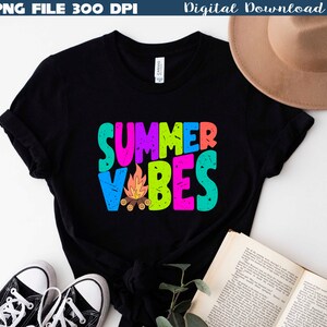 May include: Black t-shirt with the words "SUMMER VIBES" in colorful, block letters. A small campfire graphic is below the text. The words "PNG FILE 300 DPI" and "Digital Download" are at the top.