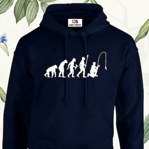May include: Navy blue hooded sweatshirt with a white graphic of the evolution of man ending with a man fishing. The graphic says "Orange Syndicate".
