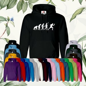 May include: A black hooded sweatshirt with a white graphic of the evolution of man, ending with a man boxing. The sweatshirt is available in a variety of colors.