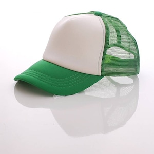 May include: A green and white trucker hat with a mesh back. The front of the hat is solid green and the back is a green mesh.