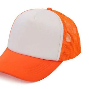 May include: A white and orange trucker hat with a mesh back. The hat has a curved brim and a flat crown.