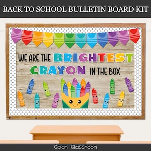 May include: A wooden bulletin board kit with a rainbow banner and the text "WE ARE THE BRIGHTEST CRAYON IN THE BOX." The board features a wooden background, a white border, and cartoon crayons with various expressions.