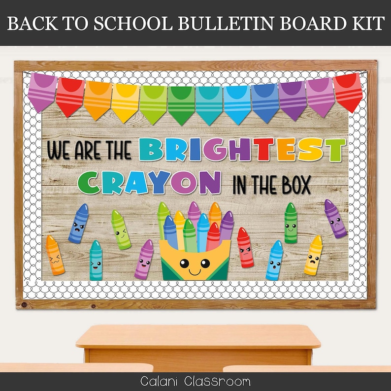 May include: A wooden bulletin board kit with a rainbow banner and the text "WE ARE THE BRIGHTEST CRAYON IN THE BOX." The board features a wooden background, a white border, and cartoon crayons with various expressions.