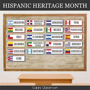 May include: A wooden board displays rectangular nameplates with flags representing various Latin American countries. The text "HISPANIC HERITAGE MONTH" is at the top. The nameplates include Argentina, Bolivia, Chile, Colombia, Costa Rica, Cuba, and others.