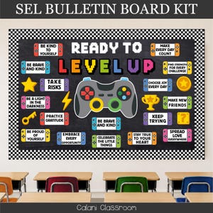 May include: A bulletin board kit featuring a black chalkboard background with a white checkered border. The text reads READY TO LEVEL UP, surrounded by colorful game controller graphics, a yellow star, a lightning bolt, a trophy, and a key.