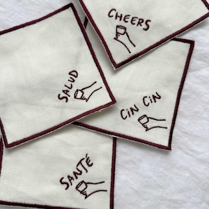 Cheers Embroidered Cocktail Coasters Napkins, Salud Sante Cin Cin, Anthropologie Oliver Bonas style coasters, aesthetic dinner party hosting