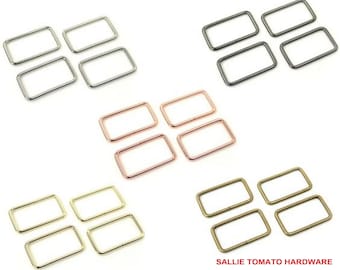 May include: Four sets of four rectangular metal rings in gold, silver, rose gold, and bronze. Each ring is approximately 2.5 cm wide and 3.8 cm long. The rings are arranged in rows of four, with each row a different colour. The text "SALLIE TOMATO HARDWARE" is at the bottom of the image.