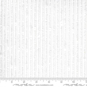 May include: A white fabric with a repeating pattern of words and phrases printed in a gray font. The fabric is measured with a ruler in inches. The words include "fernweh", "moonwake", "cordillera", "wanderlust", "wayfarer", "solivagant", "peregrinate", "alpenglow", "psithurism", "anthophile", "hyemation", "nelipot", "čoddiwomple", "dendrophile", "waldeinsamkeit".