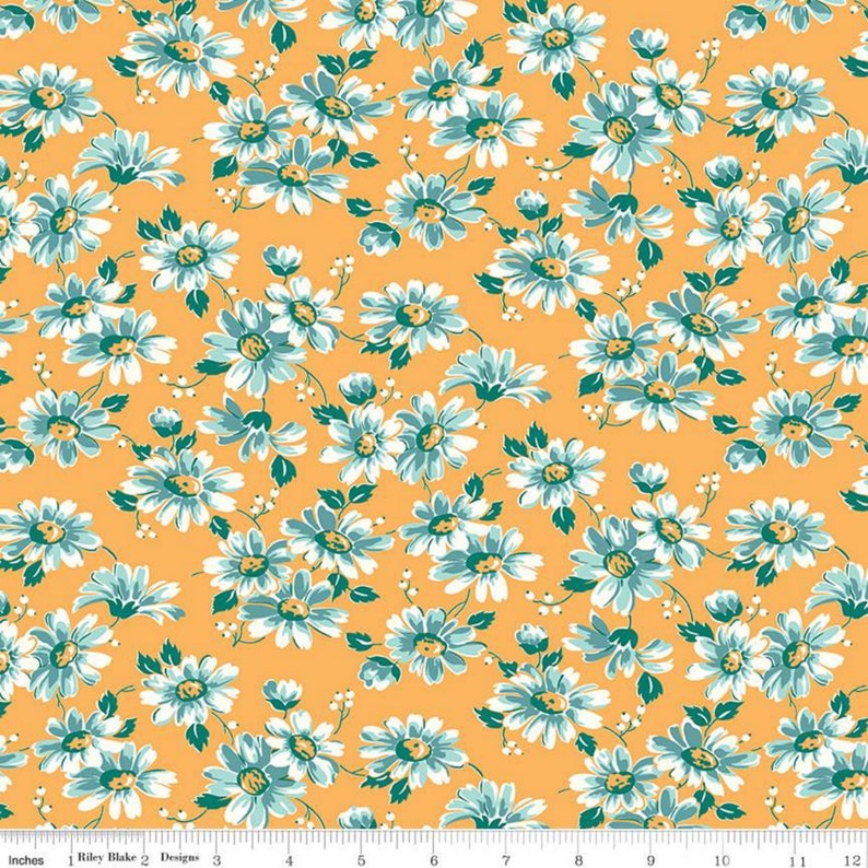May include: A yellow fabric with a white and blue floral pattern. The fabric is covered in small white daisies with blue centers and green leaves.