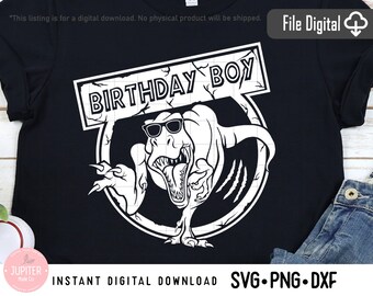 May include: A black t-shirt with a white graphic of a dinosaur wearing sunglasses and a sign that says "Birthday Boy".