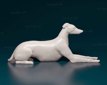 May include: A white ceramic figurine of a greyhound dog lying down on a teal blue surface.