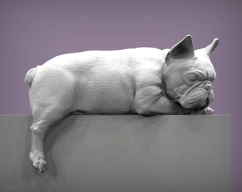 May include: A white French bulldog figurine lying down on a gray surface. The figurine is detailed with fur and has a realistic expression.