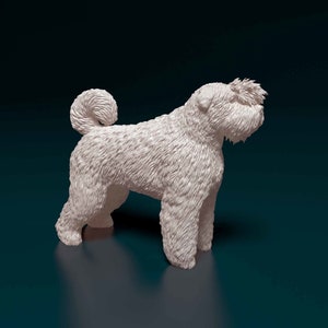 May include: A white, fluffy, soft-coated wheaten terrier dog figurine. The dog is standing on a dark blue surface and is facing to the right. The dog's tail is curled up.