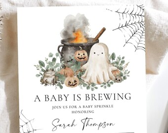 May include: A Halloween-themed baby shower invitation with a watercolor illustration of a cauldron, a ghost, and pumpkins. The text reads "A Baby is Brewing" and includes the date, time, and location of the event.