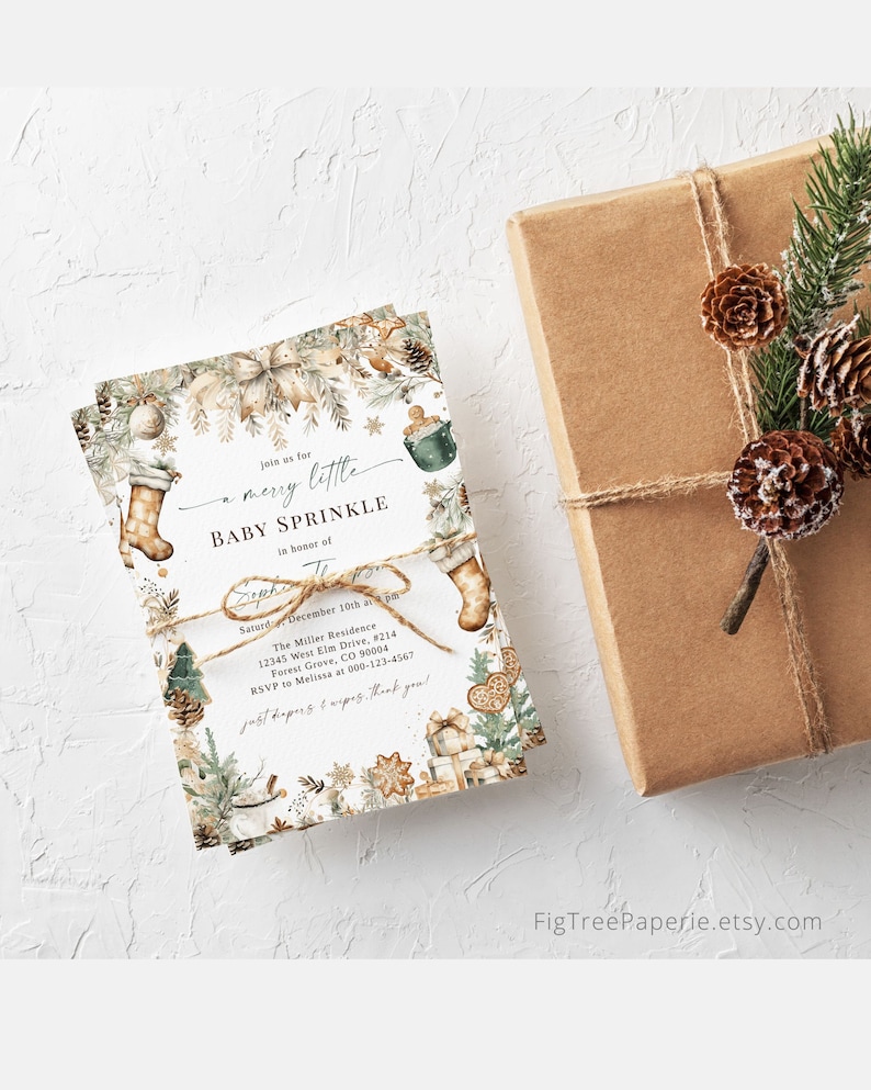 May include: A white baby shower invitation with a winter theme. The invitation features a brown stocking, a green pine branch, and a brown and white gingerbread cookie. The text on the invitation reads "Join us for a merry little baby sprinkle in honour of [name] Saturday, December 10th at 2 pm The Miller Residence 12345 West Elm Drive, #214 Forest Grove, CO 90004 RSVP to Melissa at 000-123-4567 just nappies & wipes. thank you!"