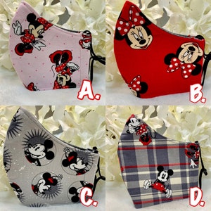 May include: Four different fabric face masks featuring Mickey Mouse and Minnie Mouse characters. The masks are in pink, red, gray, and plaid patterns. The masks are labeled A, B, C, and D.