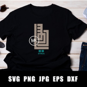 May include: Black t-shirt with a brown graphic design of the word "SYRIA" in Arabic calligraphy. The graphic is surrounded by a teal border.