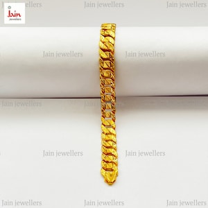 May include: A gold chain bracelet with a textured design. The bracelet is on a white surface with the text "Jain Jewellers" repeated multiple times.