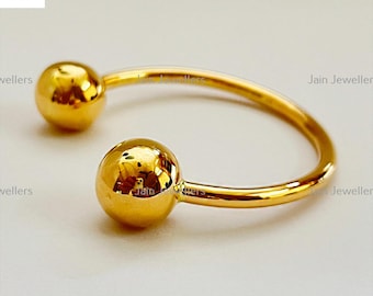 Pulseira rígida com pingente de bola em ouro amarelo maciço 22 quilates